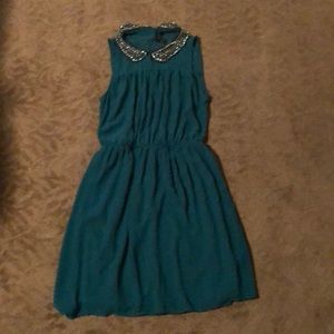 Green flowy polyester dress with a jeweled collar